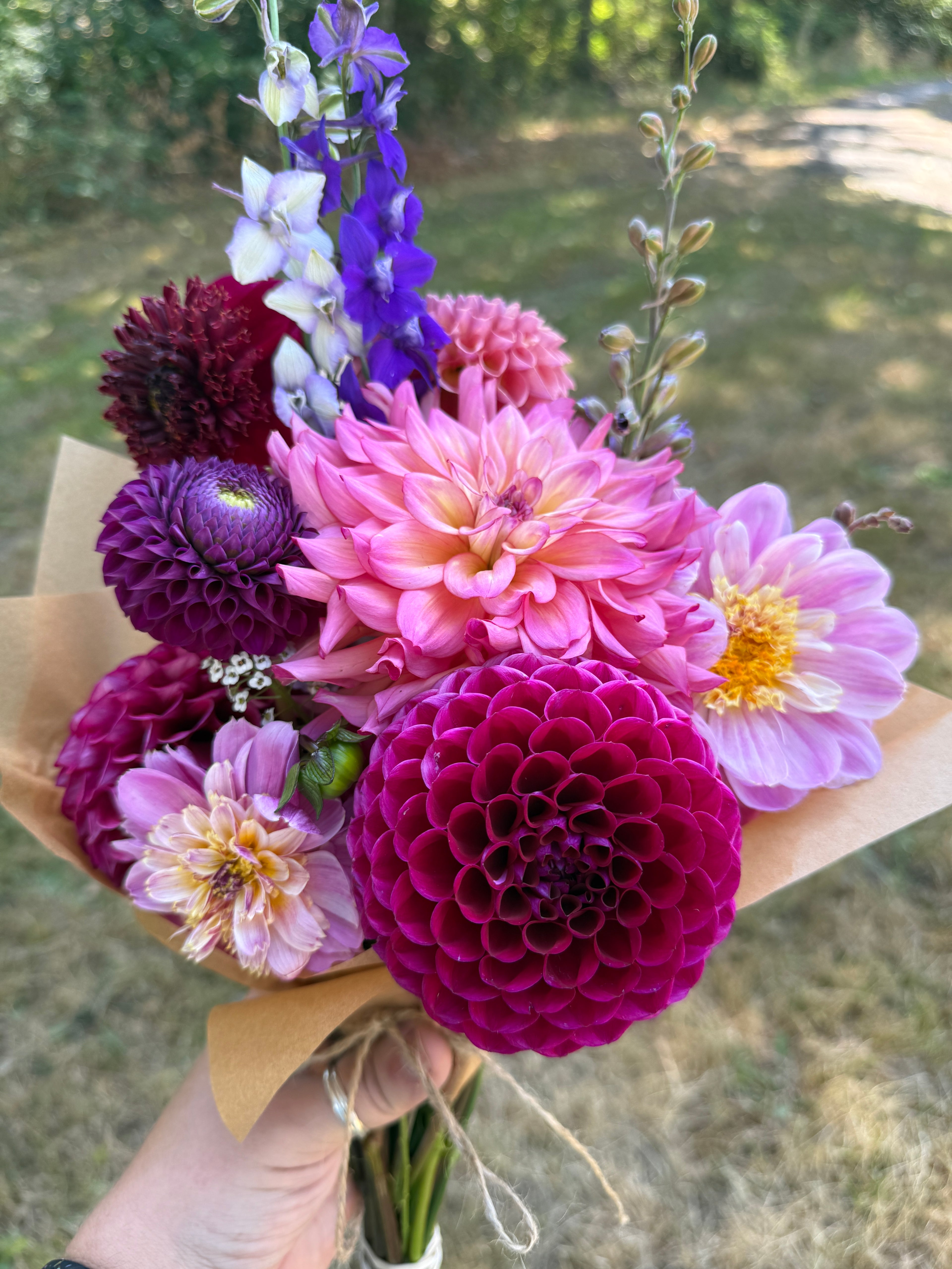 A small market bouquet from Creative Green Gardens featuring pink and purple flowers